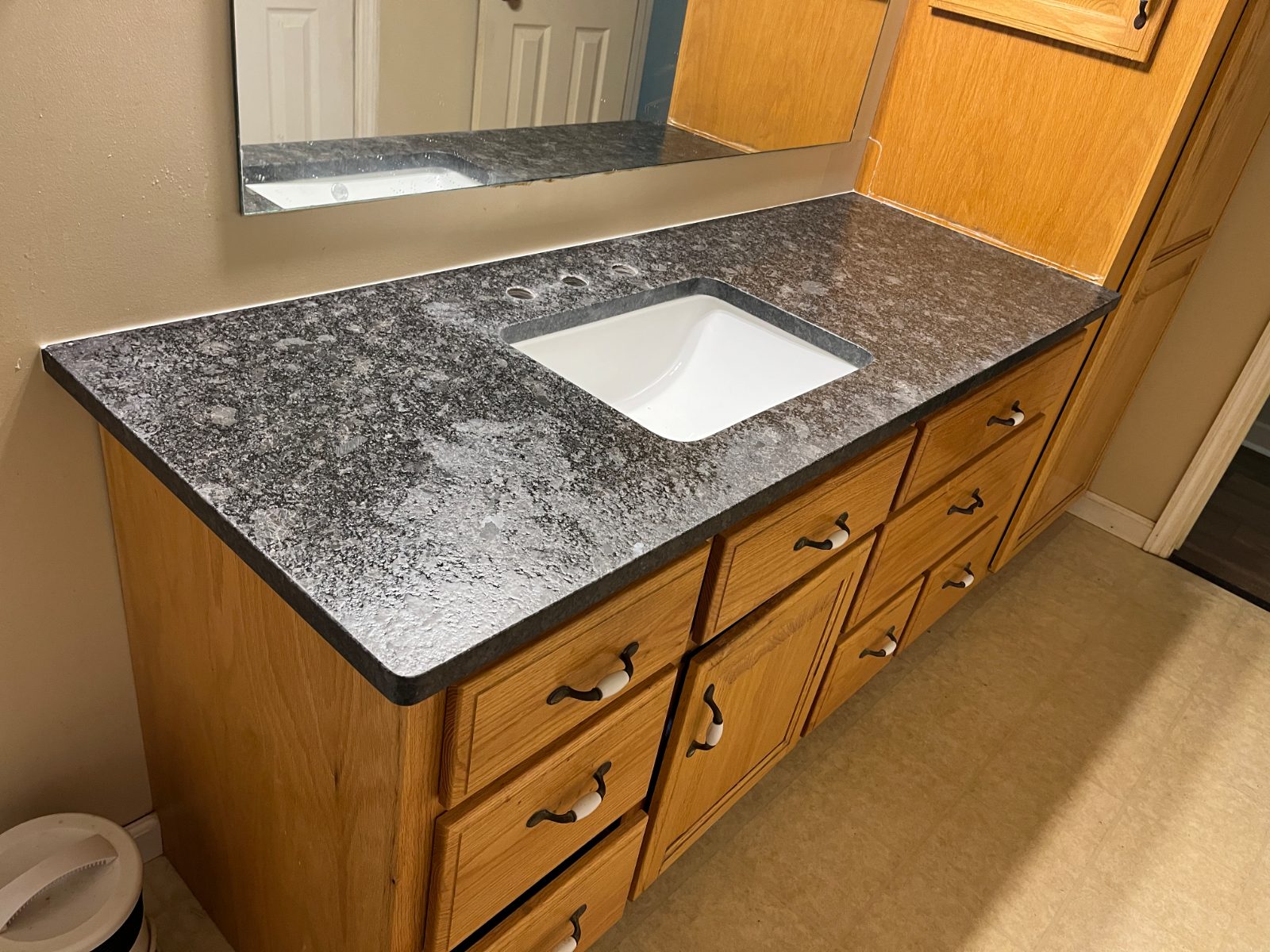 Bathroom vanity countertop installed in Warne, NC: Single bathroom vanity with an undermount rectangular sink beside a linen tower